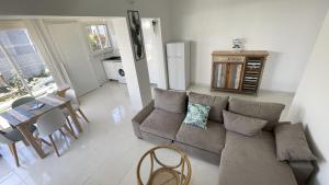 a living room with a couch and a table at LE MANGO 'Lodge in Saint-François