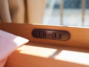 Postel nebo postele na pokoji v ubytování Tabist A Mirai Oji