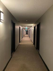 an empty hallway of a building with a long corridor at Nechako Valley Inn in Vanderhoof