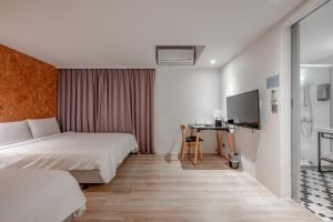 Postel nebo postele na pokoji v ubytování Light Hostel - Tainan + 37 fotografií