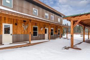 a building with snow in front of it at Bunkhouse in West Yellowstone