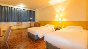 Postel nebo postele na pokoji v ubytování Aloha Hotel Roxas Boulevard Manila + 31 fotografií