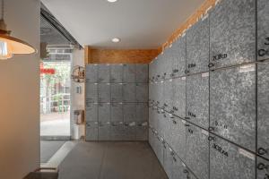 a wall of lockers in a hallway at Light Hostel in Chiayi City