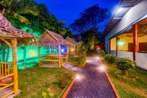 a pathway leading to a house at night at The Travelers Friend En Suite dorm room AC in Ban Ai Dao