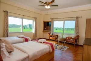 Voodi või voodid majutusasutuse Lumbini Five Elements Hotel toas