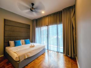a bedroom with a bed and a large window at EasyStay Genting Vista Residences 3 Bedrooms- High Floor FREE WiFi, TV Box & 1 Parking #Up to 10pax in Genting Highlands