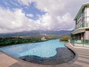 a swimming pool on the side of a building at EasyStay Genting Vista Residences 3 Bedrooms- High Floor FREE WiFi, TV Box & 1 Parking #Up to 10pax in Genting Highlands