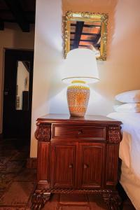 Postel nebo postele na pokoji v ubytování Hotel Casa Bansley