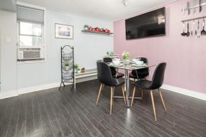 a dining room with a table and chairs at 2BR Apartment with Private Rooftop Terrace in Ottawa