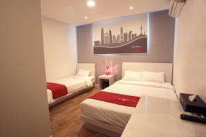 Postel nebo postele na pokoji v ubytování Jn Park Hotel Dongdaemun