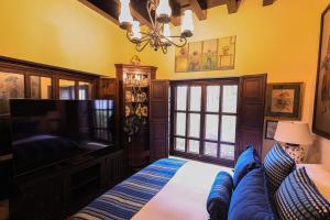 Postel nebo postele na pokoji v ubytování Hotel Casa Bansley