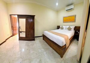 Ένα ή περισσότερα κρεβάτια σε δωμάτιο στο Bali Emerald Apartments +98 φωτογραφίες