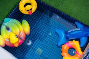 a toy swimming pool with some toys in it at Ocean Pool Villa Pattaya in Bang Sare