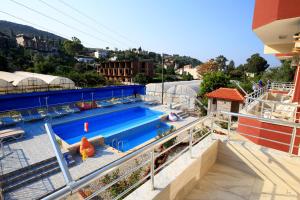 a swimming pool on top of a building at Rose Hotel B&B in Patara