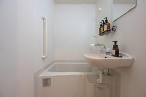 Ein Badezimmer in der Unterkunft HOTEL R9 The Yard Tsuchiura