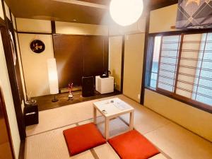 a small room with a table and a window at SAMURISE KURA in Fujikawaguchiko