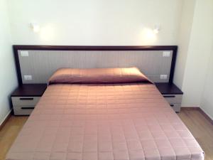 A bed or beds in a room at Tempo Di Sole con Serv Spiaggia