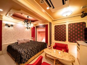 Postel nebo postele na pokoji v ubytování Roselips Tsuruhashi ローズリップス鶴橋adult only
