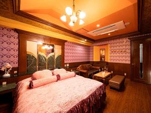 Postel nebo postele na pokoji v ubytování Roselips Tsuruhashi ローズリップス鶴橋adult only