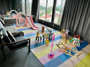 a living room with a play area with a playground at Le Dream Boutique Hotel in George Town +25 photos