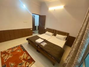 Ένα ή περισσότερα κρεβάτια σε δωμάτιο στο Orchid Apartments