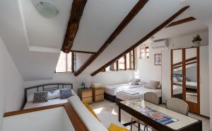 a living room with a couch and a table at B&B BUZA HOUSE in Dubrovnik