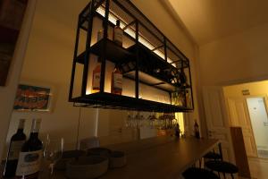 a room with a bar with bottles of wine at THE GEM BOUTIQUE HOTEL in Beirut