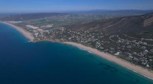 an aerial view of a beach next to the ocean at Playa Blanca Zahara in Zahara de los Atunes
