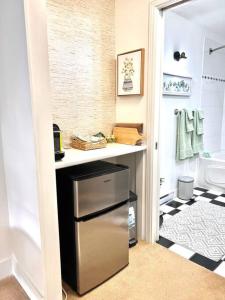 a kitchen with a small refrigerator in a bathroom at 'Canyon Heights' Retreat (Grouse Mountain) in North Vancouver