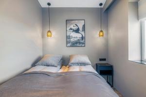 Letto o letti in una camera di Bay View Apartments