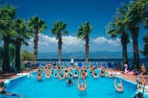 a group of people in the swimming pool at a resort at HOTEL SISSY in Kamena Vourla