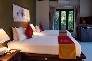 Letto o letti in una camera di Victoria Cliff Hotel & Resort, Kawthaung
