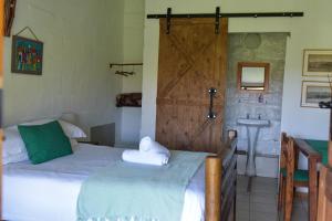 Postel nebo postele na pokoji v ubytování Intaba Lodge