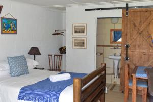 Postel nebo postele na pokoji v ubytování Intaba Lodge