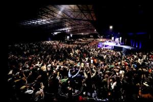 a large crowd of people sitting in a concert at Gorgeous 1-Bed apartment in Harare in Harare