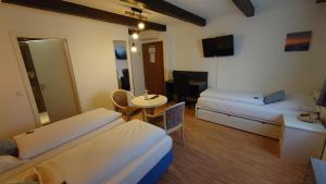 Postel nebo postele na pokoji v ubytování Hotel Alte Post