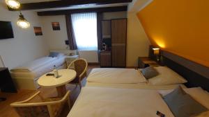 Postel nebo postele na pokoji v ubytování Hotel Alte Post