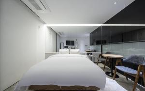 Postel nebo postele na pokoji v ubytování Cacao Hotel