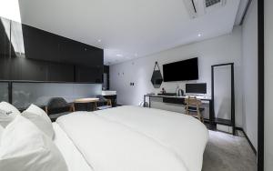 Postel nebo postele na pokoji v ubytování Cacao Hotel