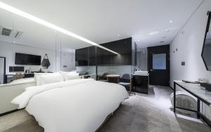 TV a/nebo společenská místnost v ubytování Cacao Hotel