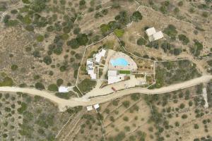 an overhead view of a building with a road at Amorgion Village in Katapola