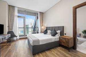 Voodi või voodid majutusasutuse Unlock J One Downtown Dubai toas