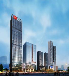 a group of tall buildings in a city at Yuwa Serviced Residence in Foshan