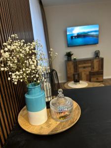 A television and/or entertainment centre at Vienibas Apartaments