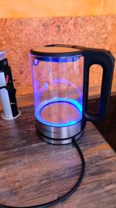 a black and blue mug sitting on a table at Casa Colore with Garden and Courtyard in Wiesbaden