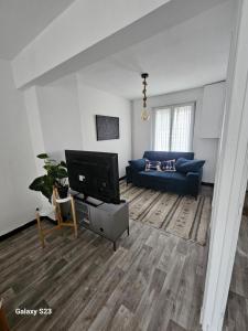 Et tv og/eller underholdning på La Maison cosy de ville 3 chambres + 4 billeder