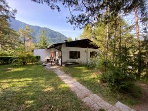 a small white house in the middle of a yard at Ferienhaus Schuchter in Sautens