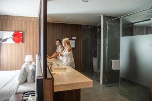 a man and woman standing in a hotel bathroom at Promotion Early Booker Corner Villa 5 Bedrooms infinity Pool & BBQ Outdoor in Nha Trang +88 photos
