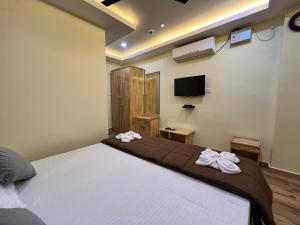 Ein Bett oder Betten in einem Zimmer der Unterkunft Hotel MTown