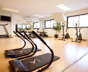 a gym with treadmills and elliptical machines at Hotel Pabisa Chico in Playa de Palma